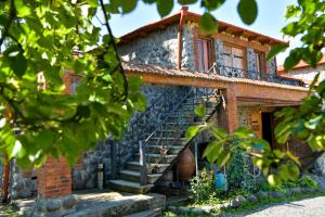 a brick house with stairs in front of it at Baias Wine in Bagdatʼi +35 photos