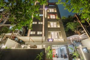 a tall building with a sign on it at RCC Hotels Elite Begumpet in Hyderabad