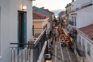 a view of a city street from a balcony at DownTown Hotel in Nafplio
