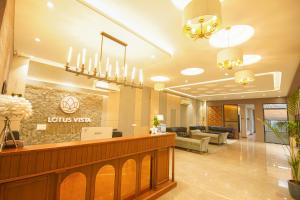 a lobby of a hotel with a waiting room at Lotus Vista Hotel in Alwar