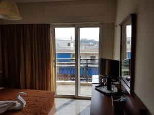 Postel nebo postele na pokoji v ubytování Apollo Hotel