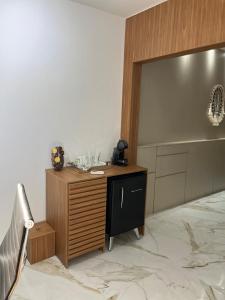 a kitchen with a wooden counter and a sink at Office-Stay in Casimiro de Abreu