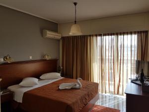 Postel nebo postele na pokoji v ubytování Apollo Hotel