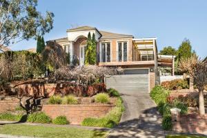 a large house with a brick driveway at The Lakeview in Lilydale