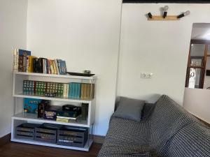 a room with a book shelf filled with books at Las Tres Patas Complejo Rural in Enix