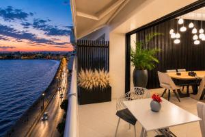 a balcony with a view of the water at ICONIC SALONICA SUITES seafront in Thessaloniki
