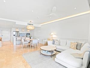 a living room with a couch and a table at La Sirène in Simpson Bay