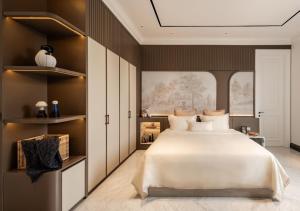 a bedroom with a large white bed and a window at Hotel Fairmounts Plaza Near IGI International Airport Delhi in New Delhi +17 photos