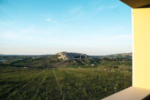 a view of a hill with a cross on top of it at Masseria Marchesani in Montenero di Bisaccia