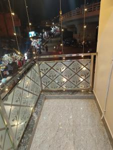 a view from the balcony of a building at night at Hotel Malik Palace in Noāmundi +3 photos