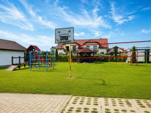 a playground in a park with a building at Rowyhills in Rowy