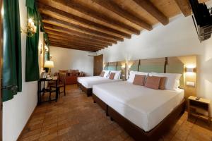a bedroom with two beds and a living room at Ca' Tessera Venice Airport in Tessera +65 photos