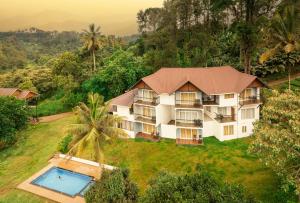 an aerial view of a resort with a swimming pool at Velvet Revive Munnar in Munnar