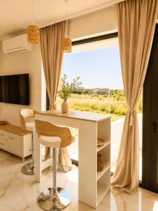 a room with a white desk and a window at Amore Fanari in Fanari