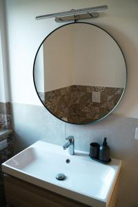 a bathroom with a sink and a mirror at Masseria Marchesani in Montenero di Bisaccia +18 photos
