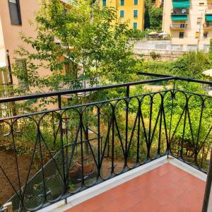 a balcony with a black railing and a garden at Bolle Apartment Monterosso al mare in Monterosso al Mare