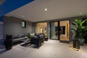 a living room with a couch and a table at View Villas Collection in Vinišće