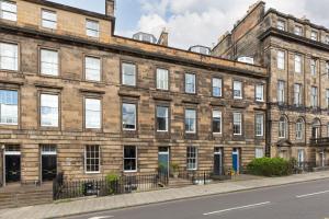 a large brick building on the side of a street at West End Townhouse in Edinburgh