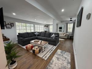 a living room with a couch and a table at Poconos Hideaway in Greentown