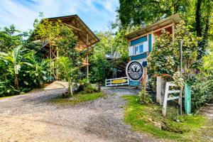 a house with a sign in front of it at Bocas Stoked Monkeys in Bocas Town