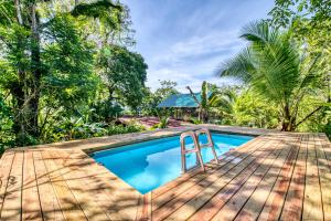 a swimming pool on top of a wooden deck at Bocas Stoked Monkeys in Bocas Town