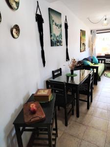 a living room with a table and a couch at Casita Tafí del Valle in Tafí del Valle