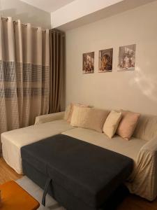 a bed in a bedroom with two pictures on the wall at MK Suites CDO in Pontud +6 photos