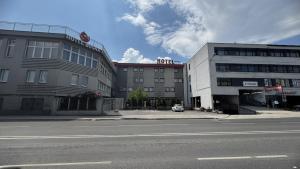 an empty street in front of a building at Hotel Bosna 1 in Sarajevo