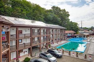an aerial view of a hotel with cars parked in the courtyard at Dallas in Solotvyno