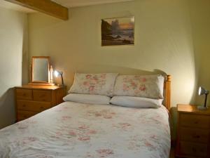 a bedroom with a bed and a picture on the wall at Fennel in Kelly