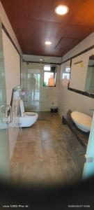 a bathroom with two sinks and a tub at Holiday villa in Lonavala +11 photos