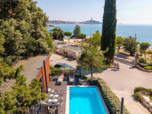 an aerial view of a resort with a swimming pool at Porton Nature Hideouts in Rovinj