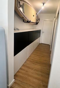 a small room with a surfboard on the wall at Studi'eau2 in Ostend
