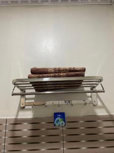 a stack of towels on top of a shelf at Sekar Homestay in Bantul
