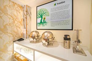 a display case with two gold helmets on a counter at Treebo Sheel, Near Mall Road in Shimla