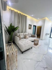 a living room with a couch and a table at La Casa Residence in Dakar