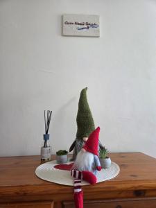 a christmas gnome sitting on top of a table at Casa Nanà Beach in Lido Adriano