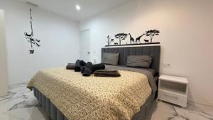 a bedroom with a bed with a teddy bear on it at Victory in Alicante