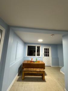 a room with a wooden table and a window at Highway 17 Space Share accommodation in Thessalon
