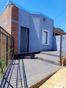 a house with a black door and a fence at Haus Eldorado in Eldorado