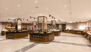 a store with several counters in a large room at Unique Residence Hotel Golf and Spa in Soke