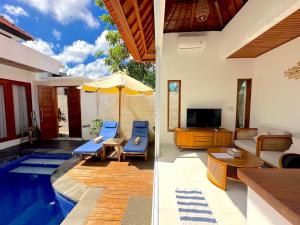 a villa with a swimming pool and a living room at Mesari Jinah Villa 1 - 2BR Private Pool Near Melasti Beach Uluwatu in Uluwatu +18 photos