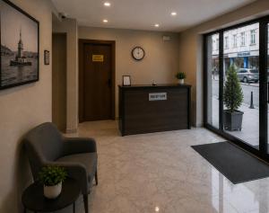a waiting room with a reception desk in a building at T h e V o i d Hotel - Just Steps From Osmanbey Metro Station in Esenyurt