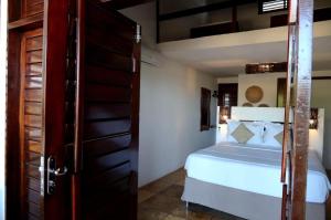 a bedroom with a bed and a bunk bed at Windtown Beach Hotel in Cumbuco +56 photos