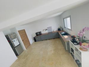 a kitchen with a sink and a counter top at villa avec piscine in Hendaye