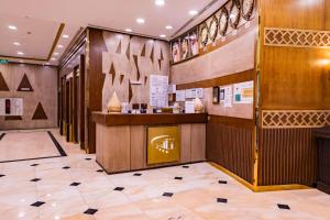 a lobby of a restaurant with a counter at Grand Zowar Hotel - فندق جراند زوار للضيافة السياحي in Medina +19 photos