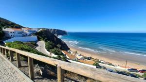 a view of the beach from a bluff at Aljezur Coast Apartment - Villa Luar in Aljezur