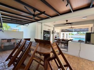 a dining room and living room with a table and chairs at Untung5tay in Gua Sai +20 photos