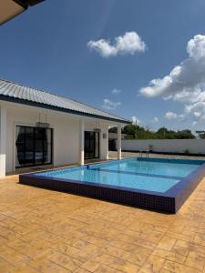 a swimming pool in the middle of a building at Untung5tay in Gua Sai