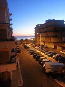 a parking lot full of cars in a city at Casa Anna in Ladispoli